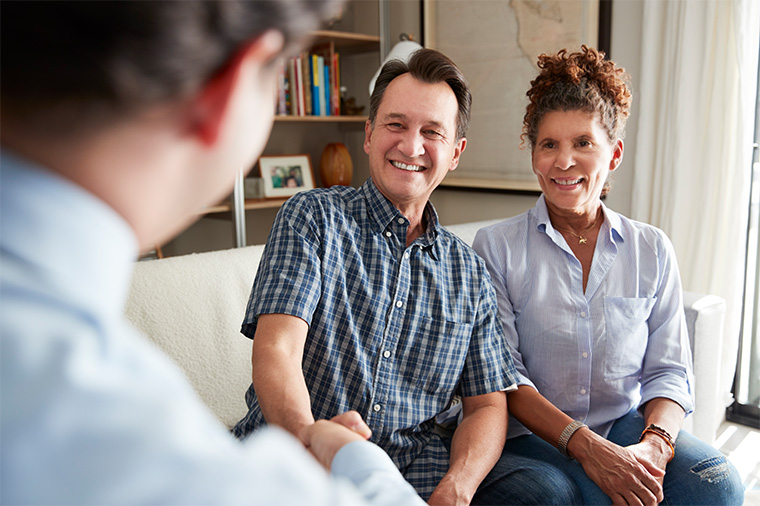couple meeting with financial advisor to discuss retirement strategies