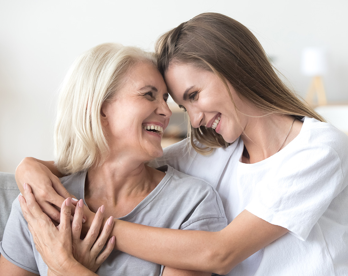 mother and daughter embracing with smiles long-term care insurance jb retirement strategies florida